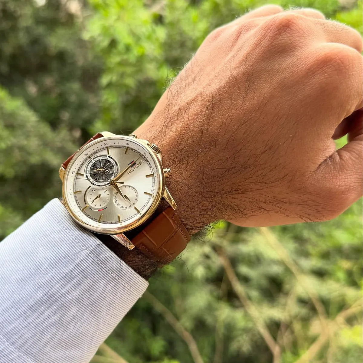 Tommy Hilfiger STANCE chronograph watch worn on wrist with white shirt cuff