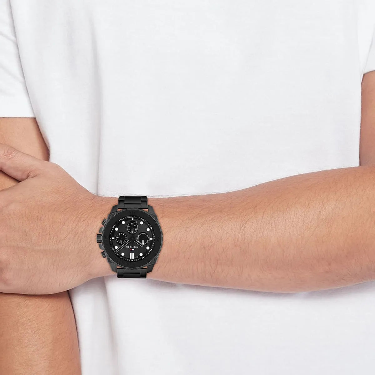 Tommy Hilfiger black chronograph watch worn on wrist