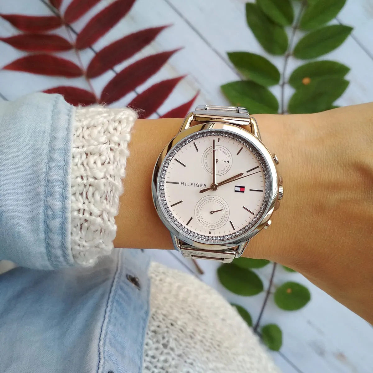 Tommy Hilfiger Carly watch worn on wrist with blush dial and crystal bezel