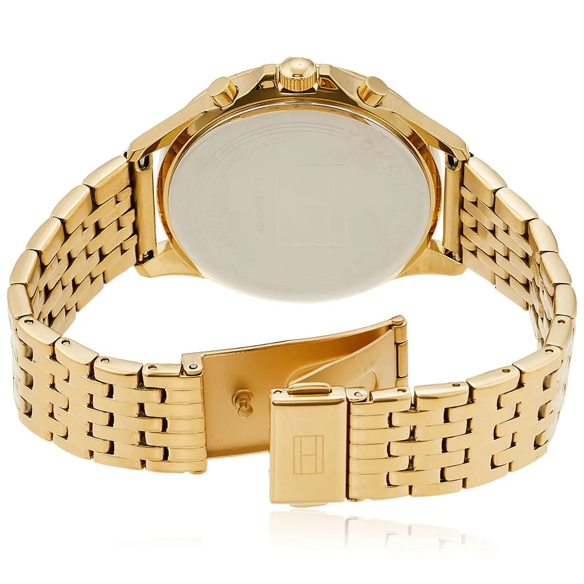 Caseback of Tommy Hilfiger Ari watch showing solid gold-tone stainless steel case with deployment clasp