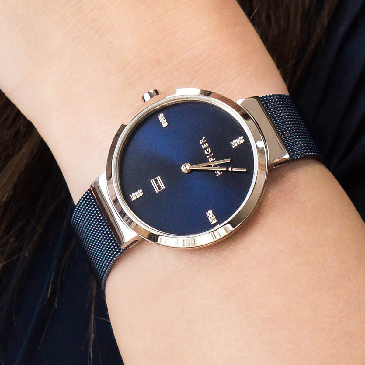 Tommy Hilfiger Liberty watch on wrist displaying blue dial with crystal accents