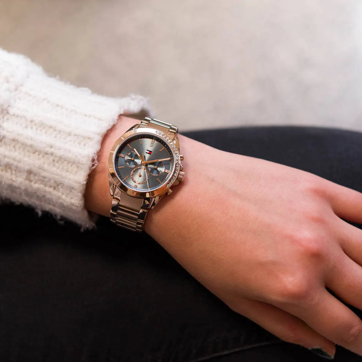 Tommy Hilfiger Kennedy women's chronograph watch on wrist with rose gold bracelet and blue dial