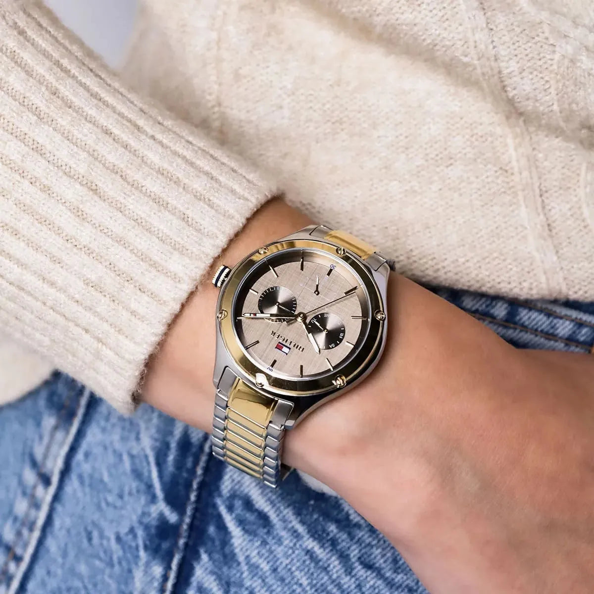 Tommy Hilfiger Lexi watch worn on wrist with light sweater and jeans