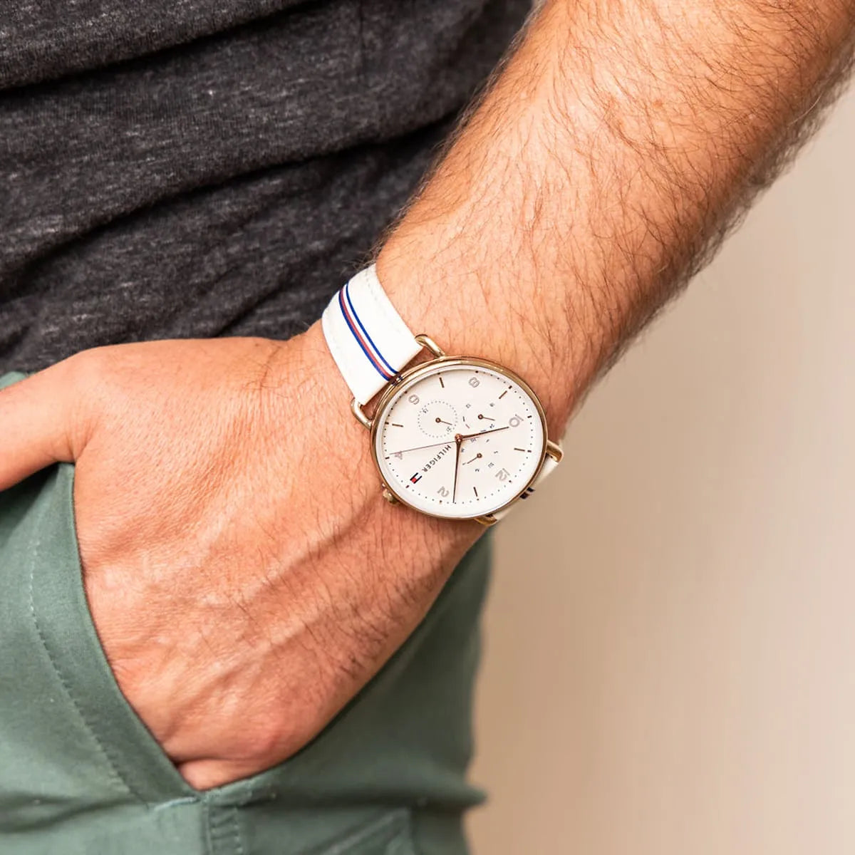 Tommy Hilfiger Lily watch worn on male wrist with cream leather strap