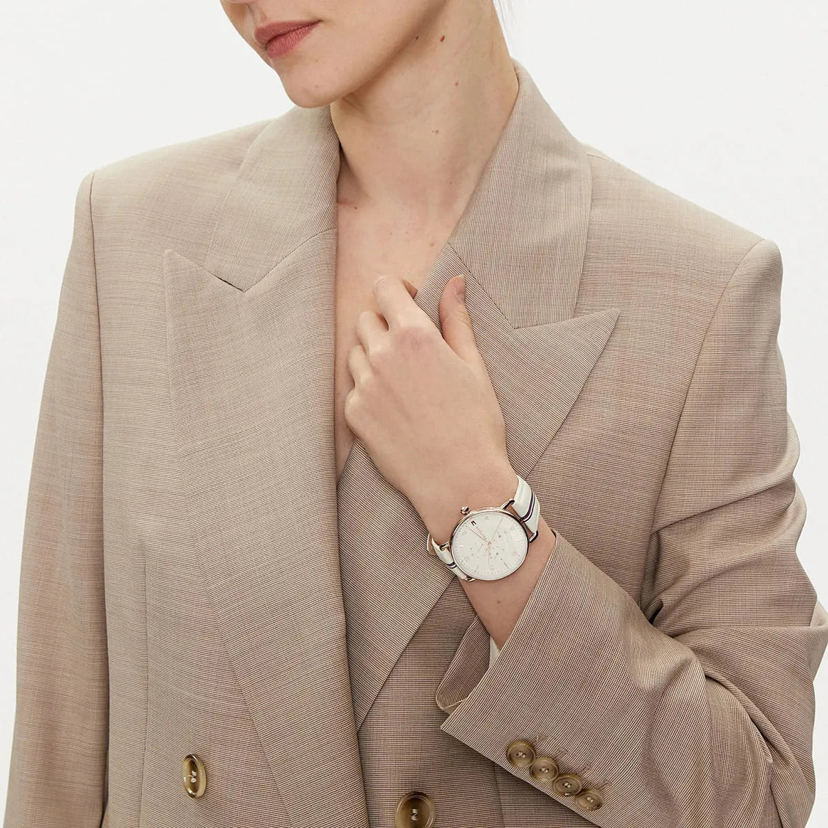 Tommy Hilfiger Lily watch styled with beige blazer on female wrist