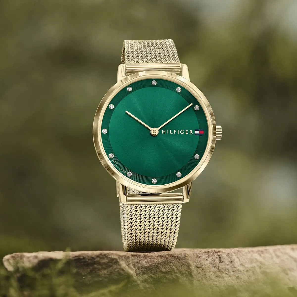 Tommy Hilfiger Pippa women's watch on wrist with green dial and gold mesh