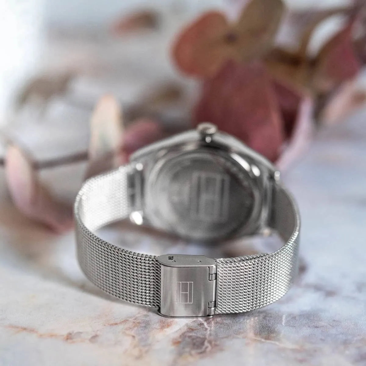 Silver mesh strap of Tommy Hilfiger Monica watch with fold-over clasp