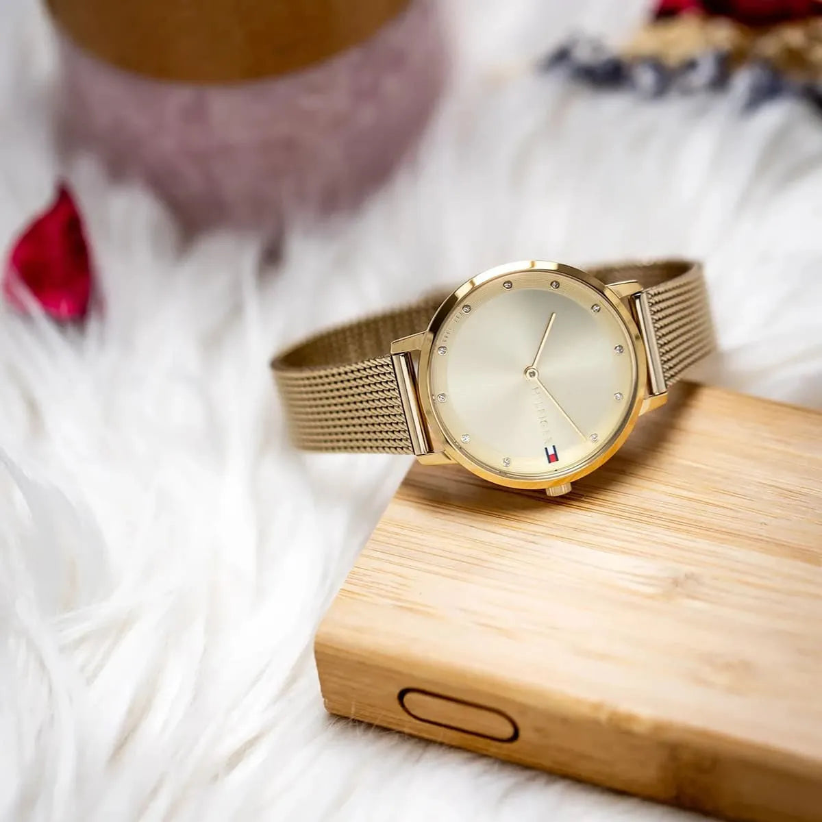 Tommy Hilfiger Pippa gold women's watch styled on wrist in lifestyle context
