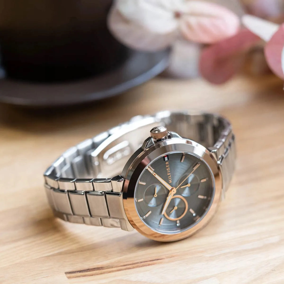 Tommy Hilfiger women's watch with chronograph subdials on wooden surface