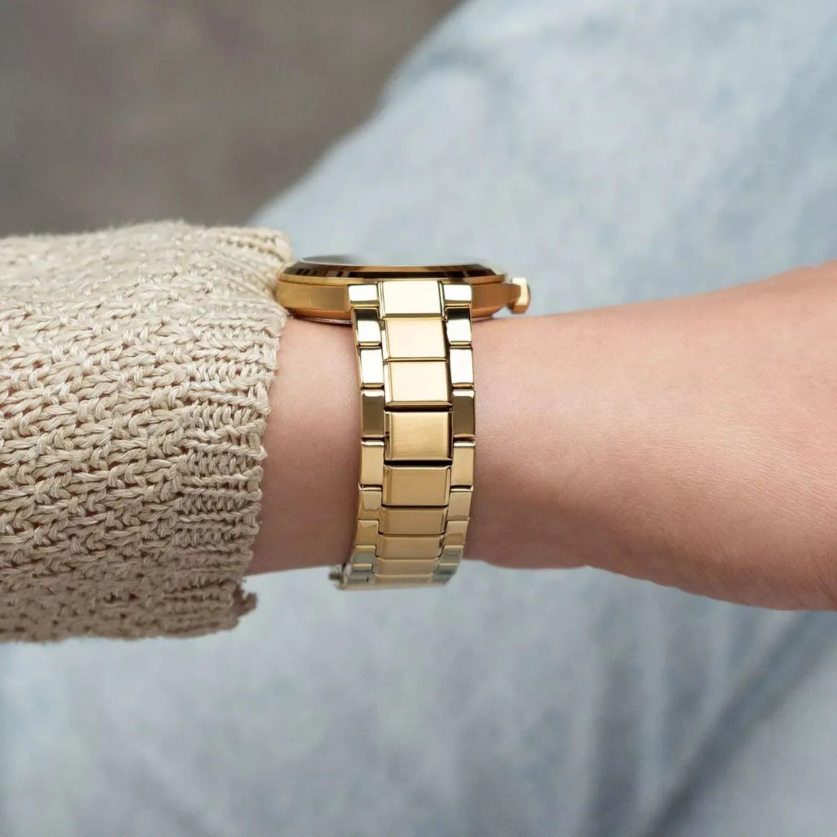 Tommy Hilfiger gold link bracelet worn on wrist showing link design and clasp