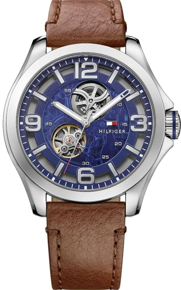 Tommy Hilfiger Bruce men's watch with blue dial, visible automatic movements, and brown leather strap