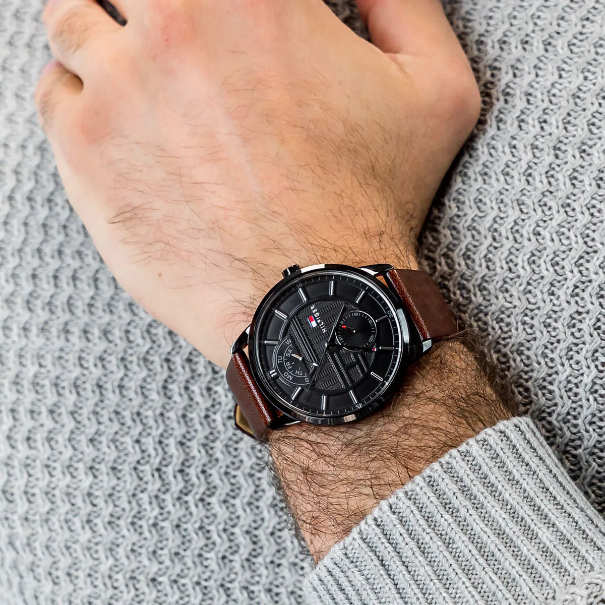 Tommy Hilfiger Hunter men's watch worn on wrist with black dial