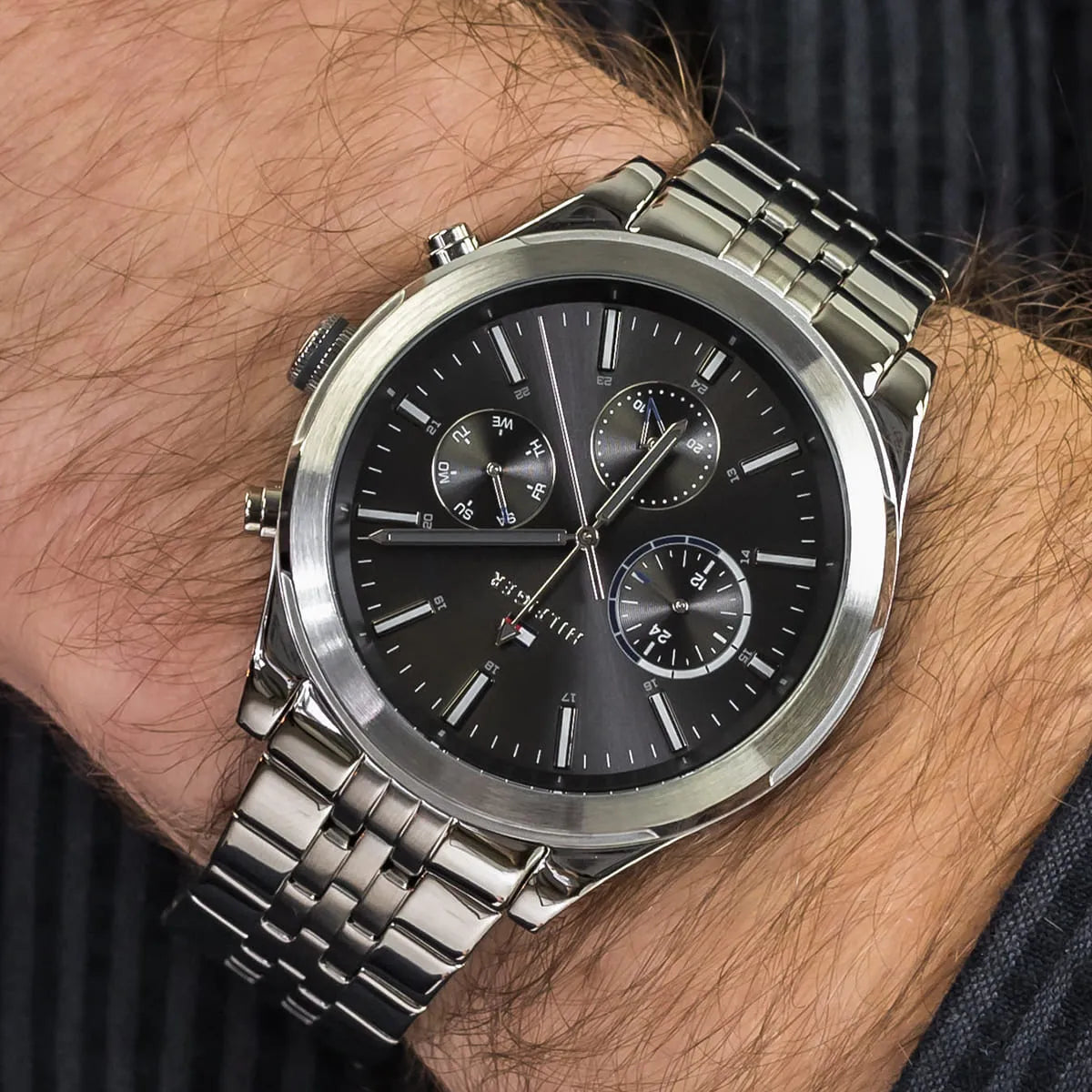 Tommy Hilfiger Ashton chronograph worn on wrist showing grey dial and steel bracelet