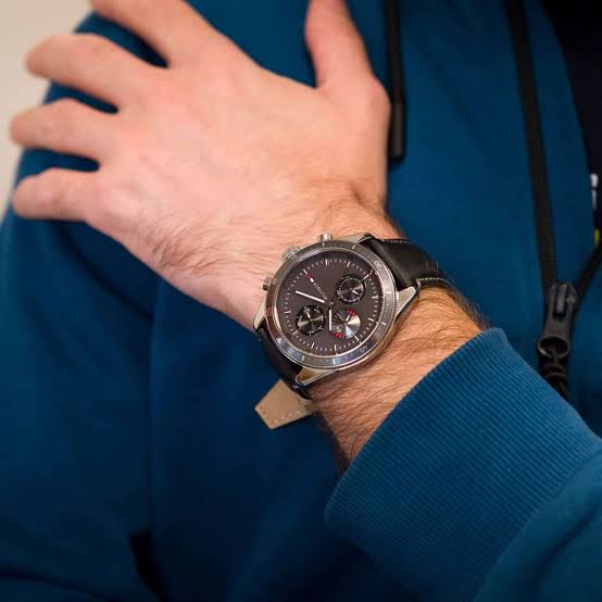 Tommy Hilfiger Parker chronograph watch worn on wrist with grey dial and black strap