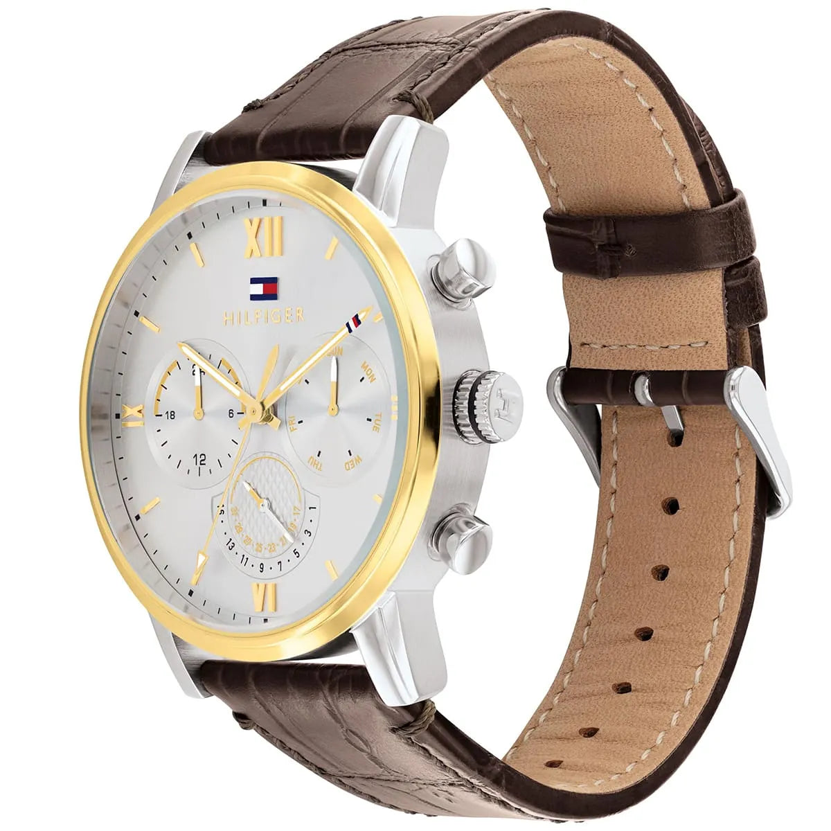 Three-quarter view of Tommy Hilfiger multifunction watch showing silver dial, chronograph subdials, and brown leather band