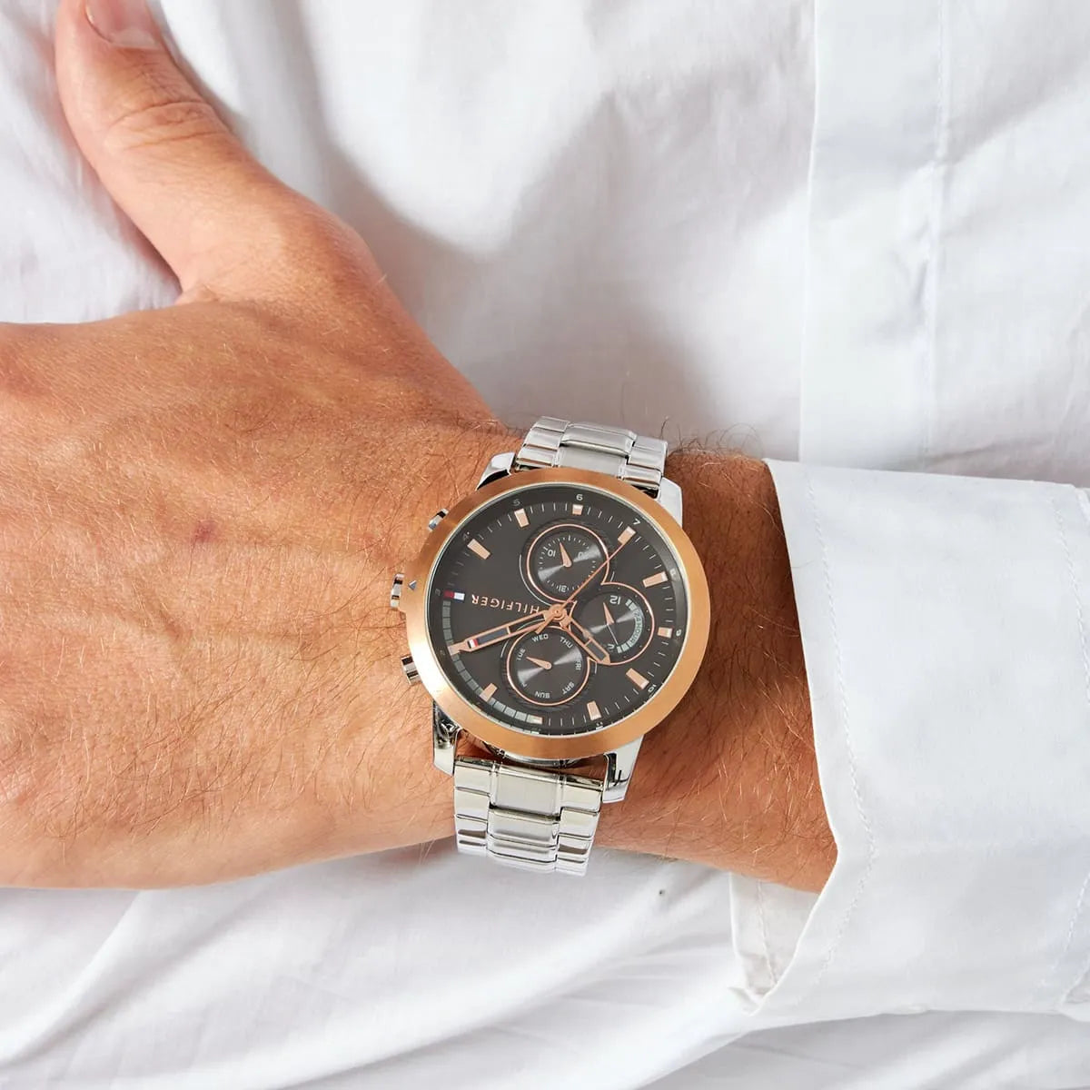 Tommy Hilfiger men's chronograph watch worn on wrist with silver bracelet