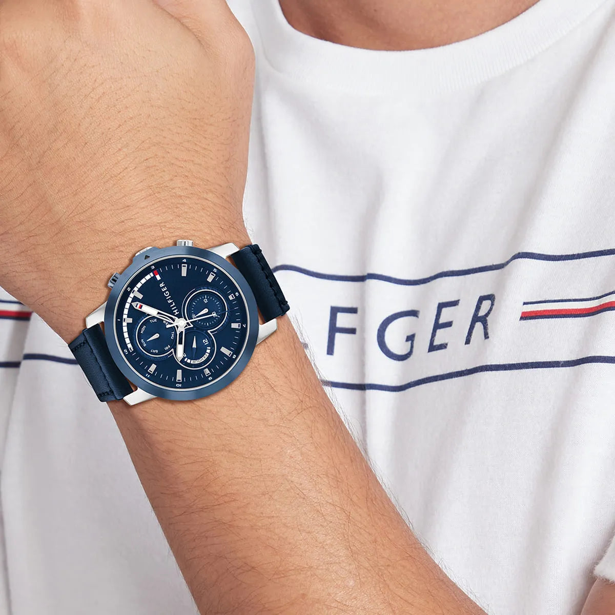 Tommy Hilfiger men's chronograph watch worn on wrist with blue dial and navy strap