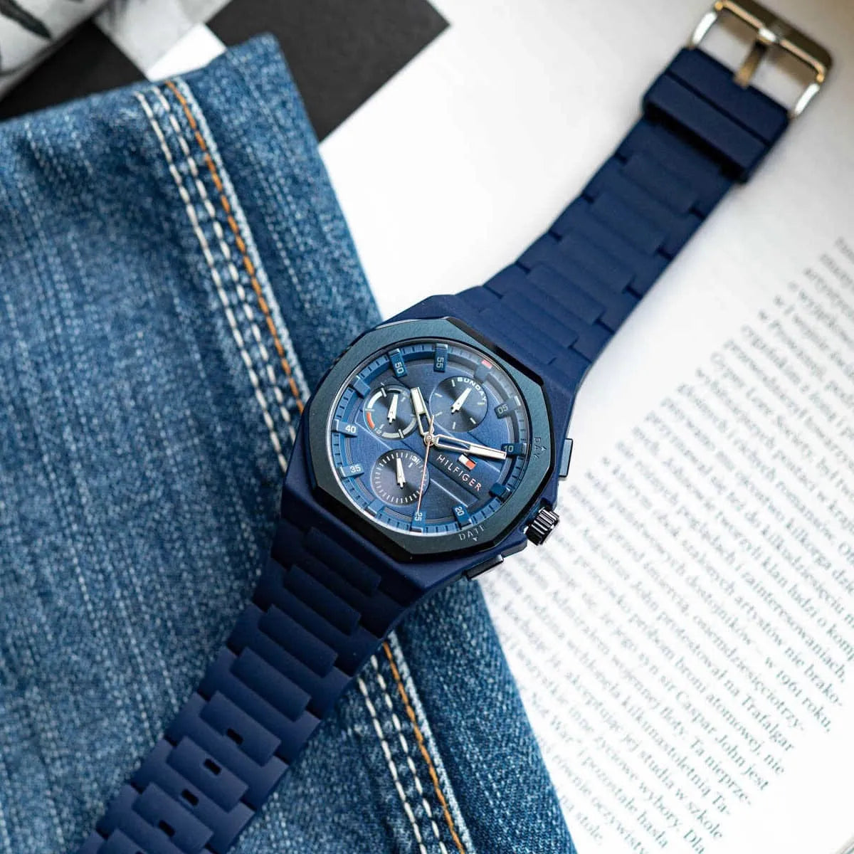 Tommy Hilfiger Neo watch worn on wrist with blue dial and rubber strap