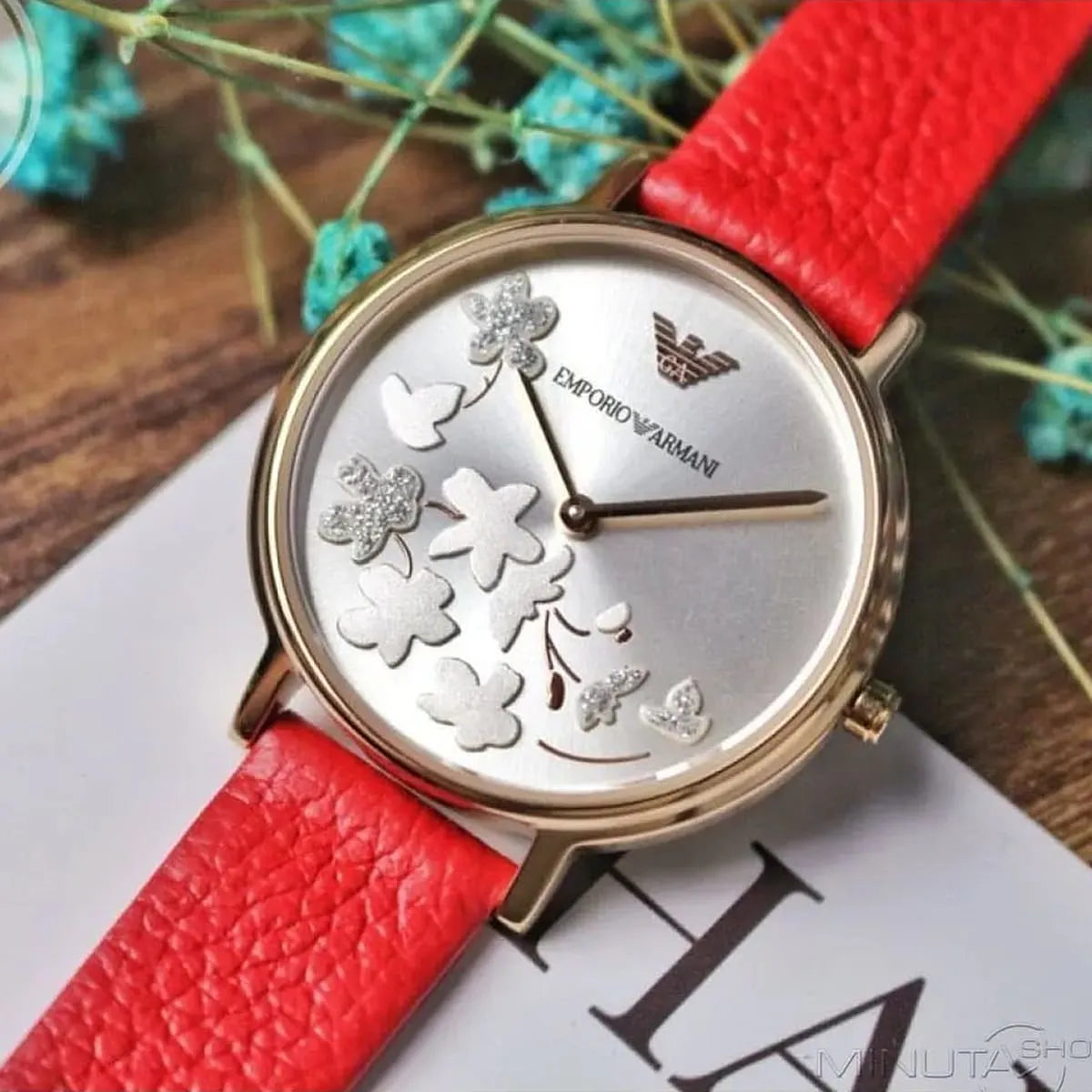 Emporio Armani Kappa AR11114 watch styled with floral decoration and red leather strap detail