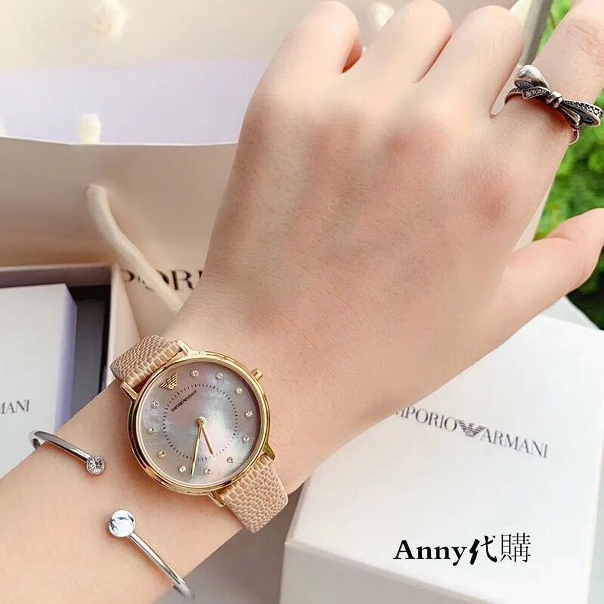 Emporio Armani Kappa watch worn on wrist with mother of pearl dial visible