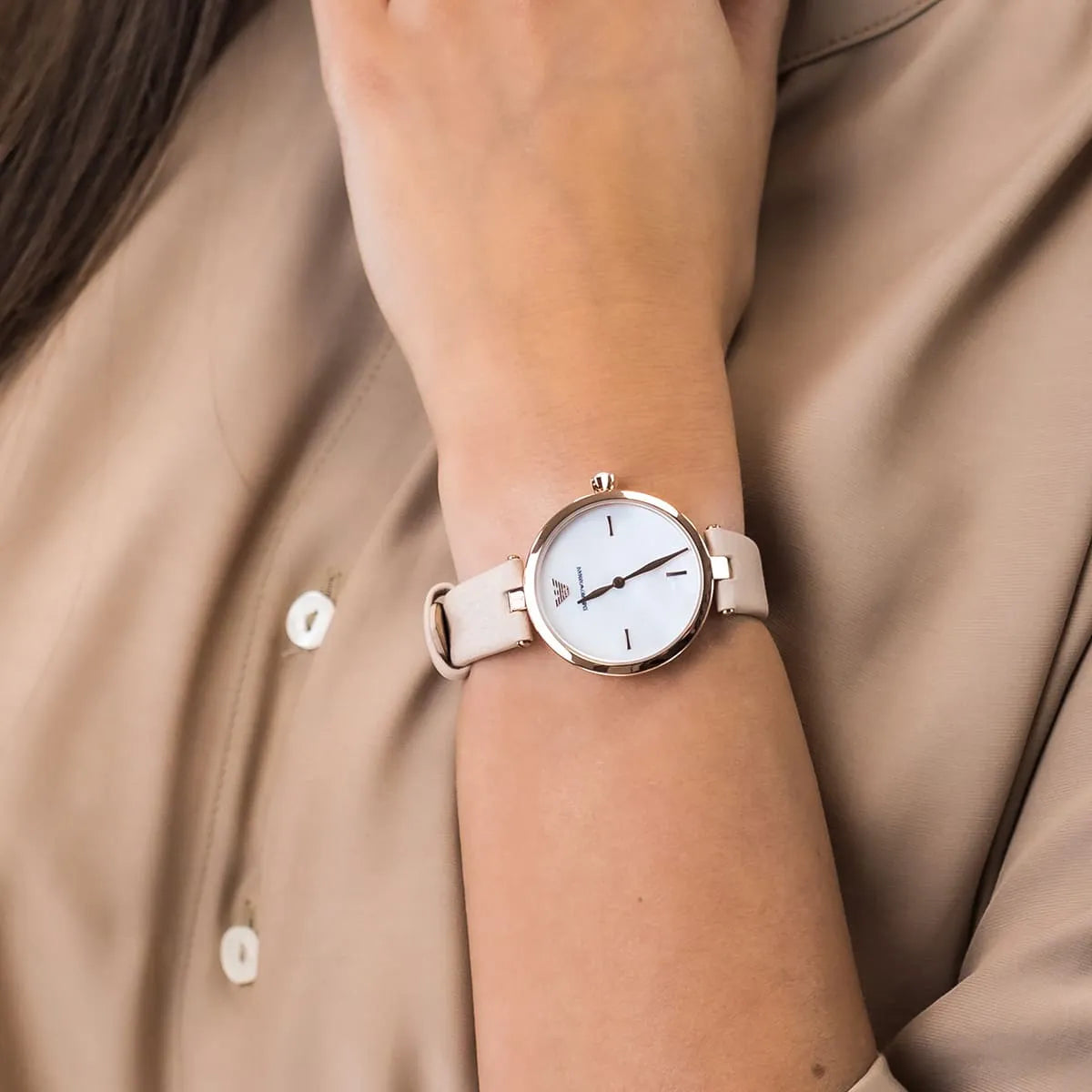 Emporio Armani Arianna worn on wrist showing slim profile with nude-pink leather strap