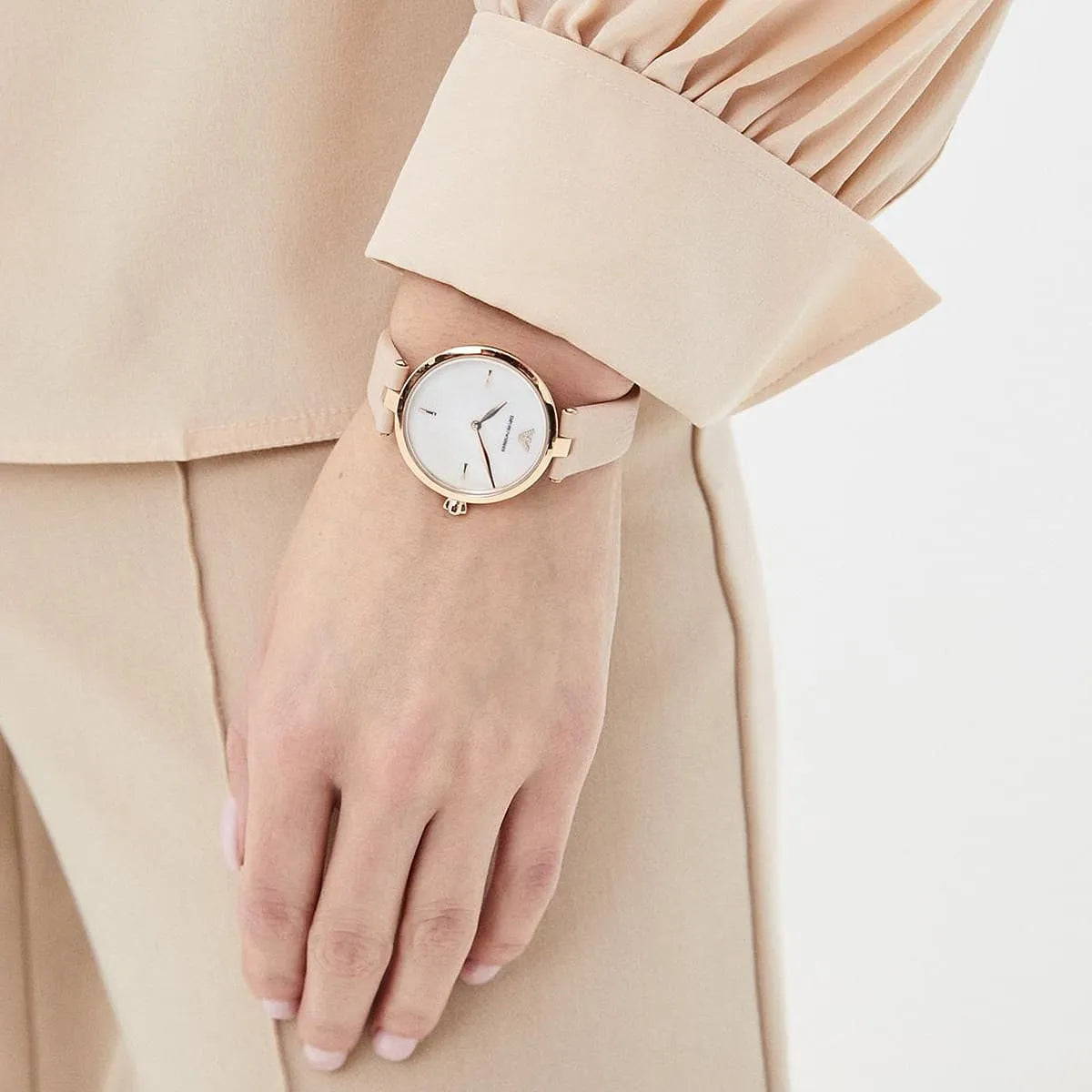 Emporio Armani Arianna watch on wrist with white dial and rose-gold case