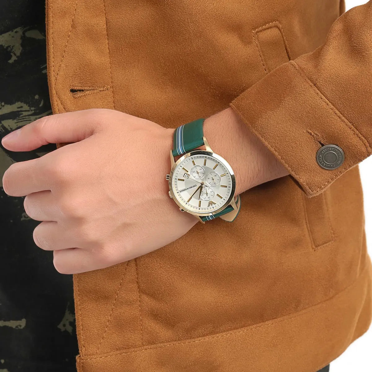Emporio Armani AR11233 worn on wrist with tan jacket, showing silver dial and green strap