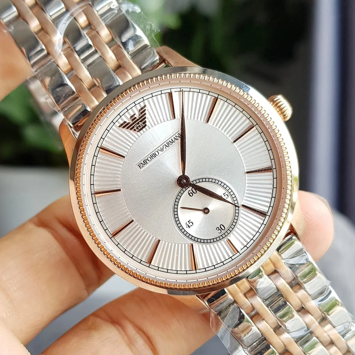 Close-up of AR1839 silver dial with rose gold indices, subdial, and beaded bezel