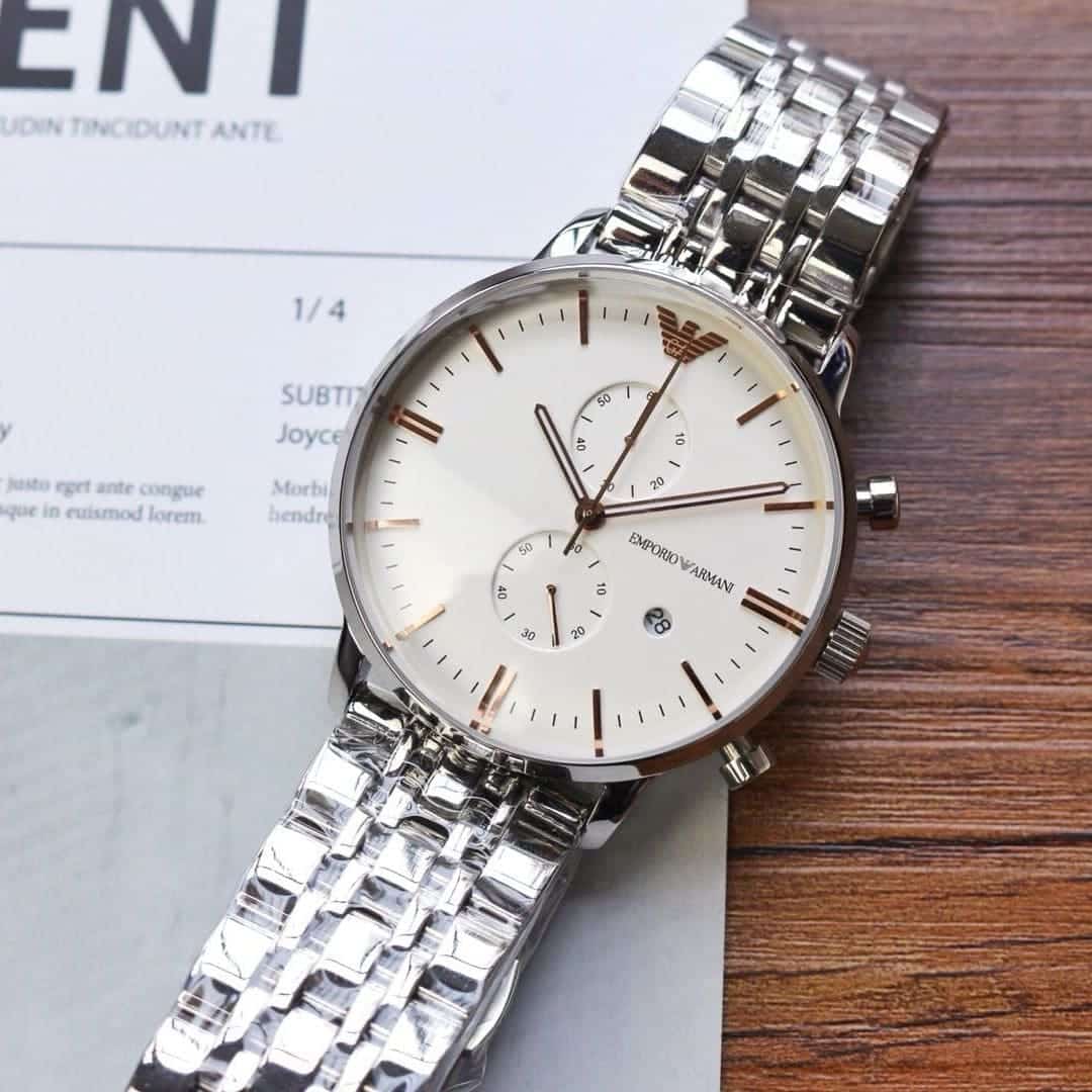 Emporio Armani AR1933 chronograph watch on wrist showing silver steel case and bracelet with white dial