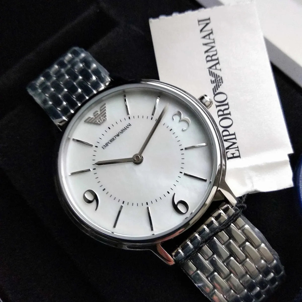 Emporio Armani Kappa women's watch on wrist with Emporio Armani packaging