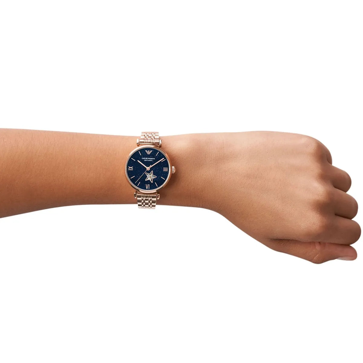 Emporio Armani Meccanico Gianni women's watch worn on wrist showing blue dial and rose gold bracelet