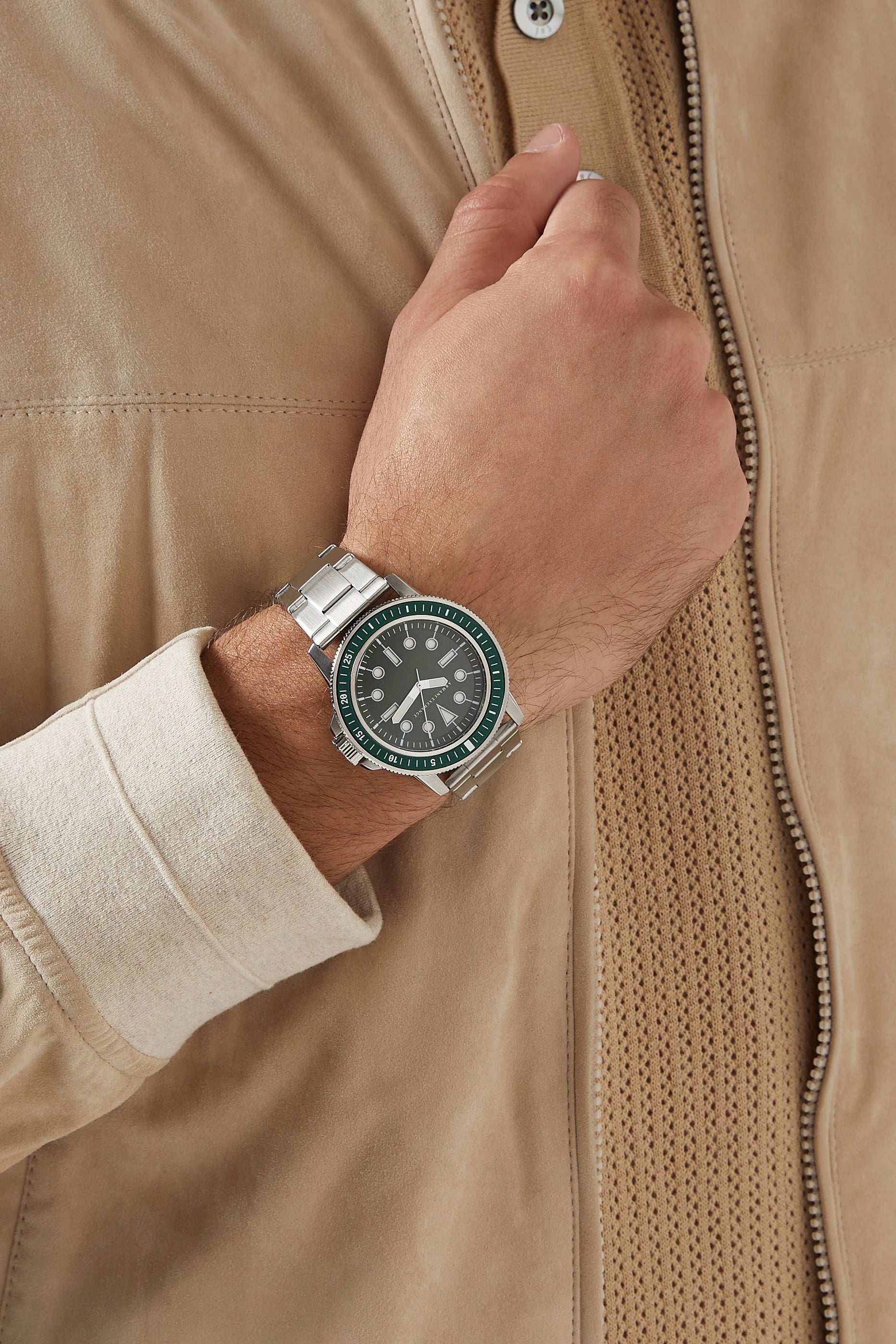 Armani Exchange Leonardo AX1860 watch worn on wrist with tan jacket