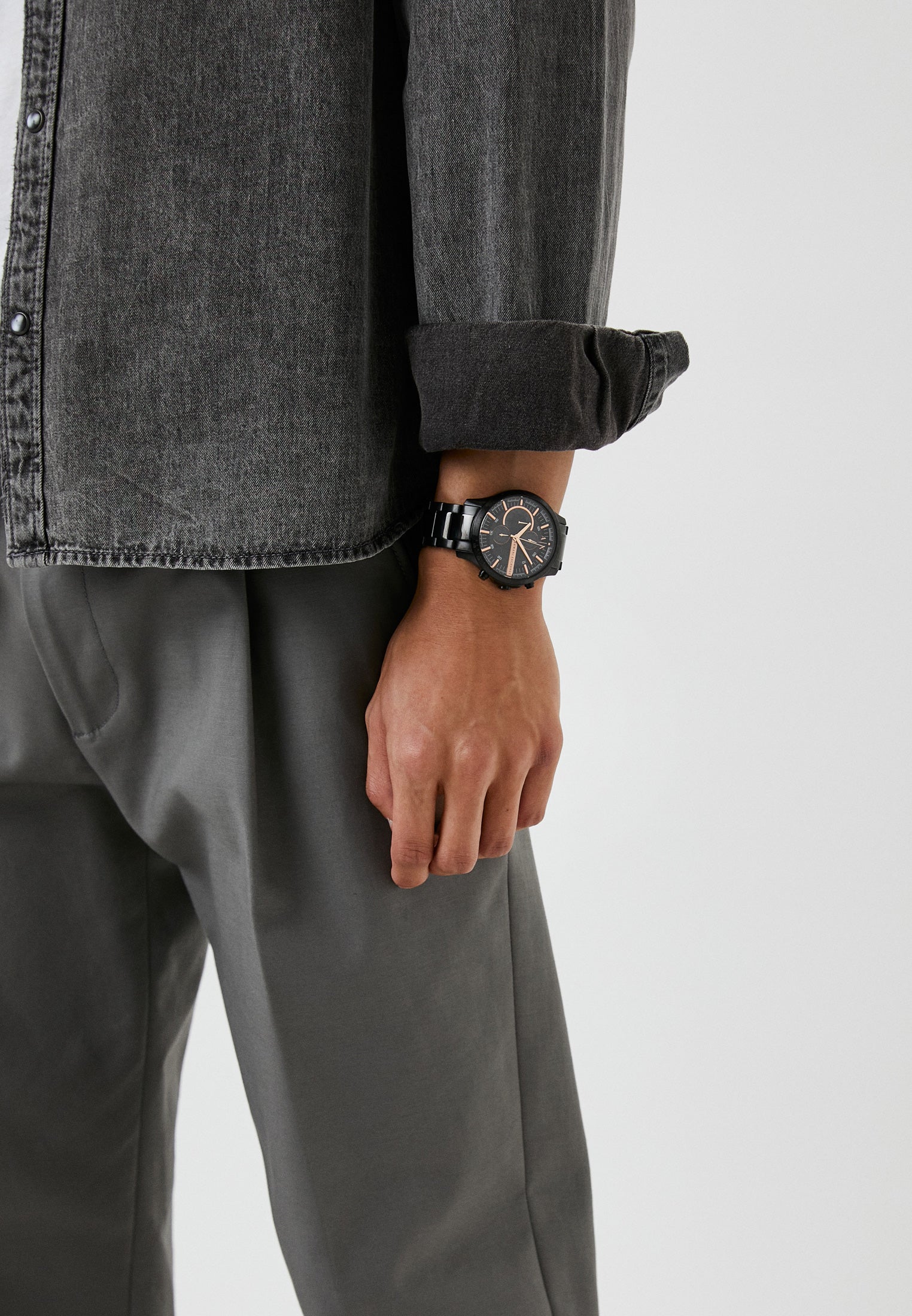 AX2429 chronograph watch worn on wrist with denim and khaki outfit