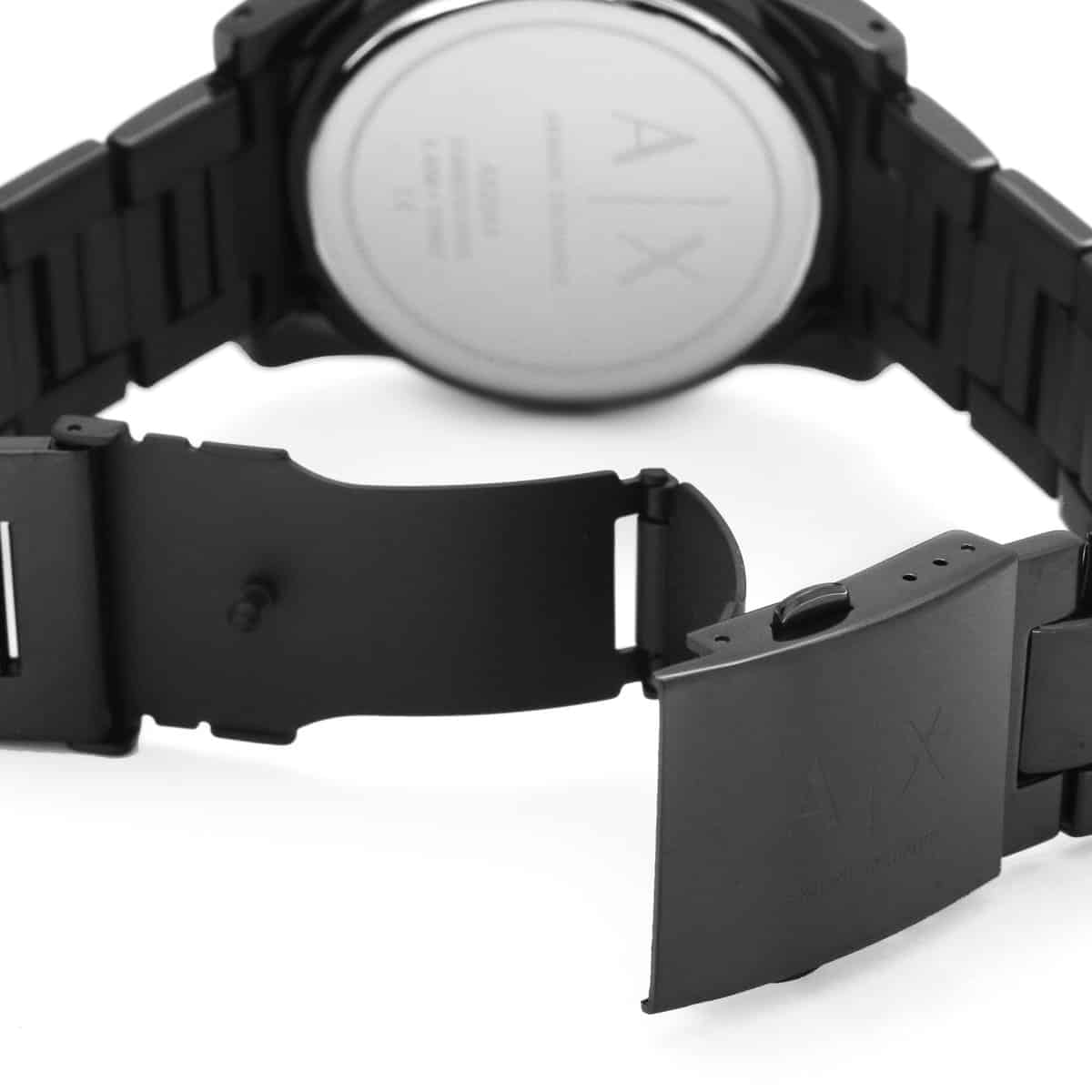 AX2093 caseback view displaying stainless steel case and metal strap assembly