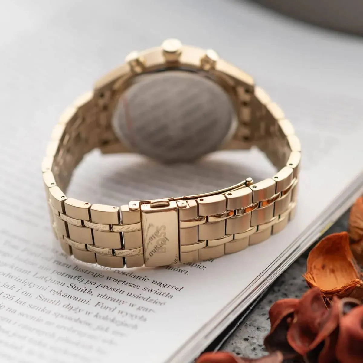 BOSS Ambassador watch side view showing gold stainless steel bracelet and case profile