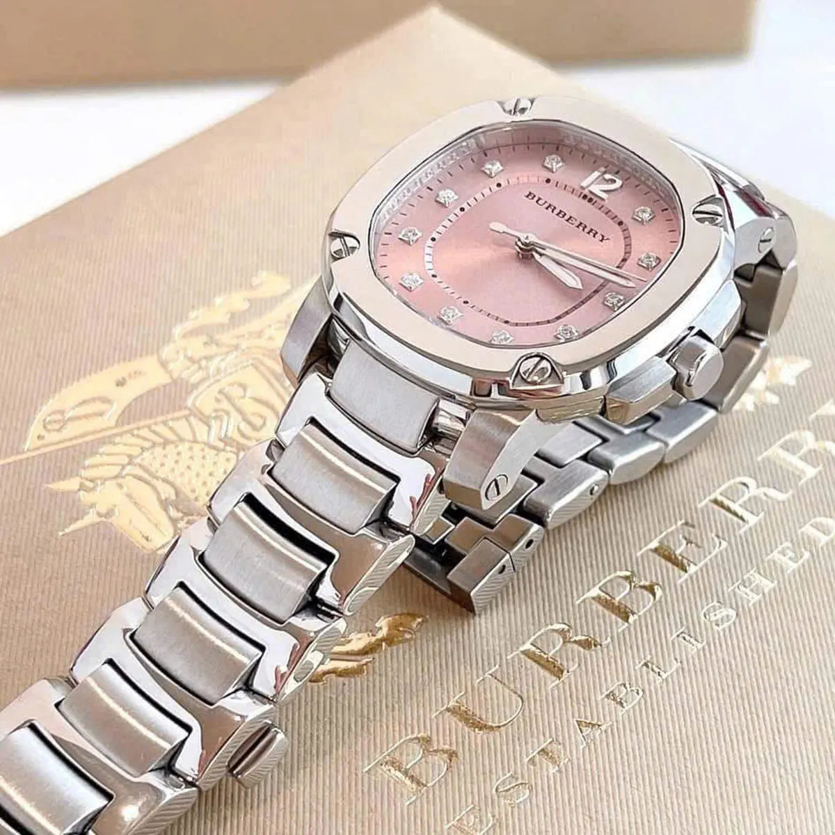Burberry Britain BBY1805 watch with pink dial displayed on branded box