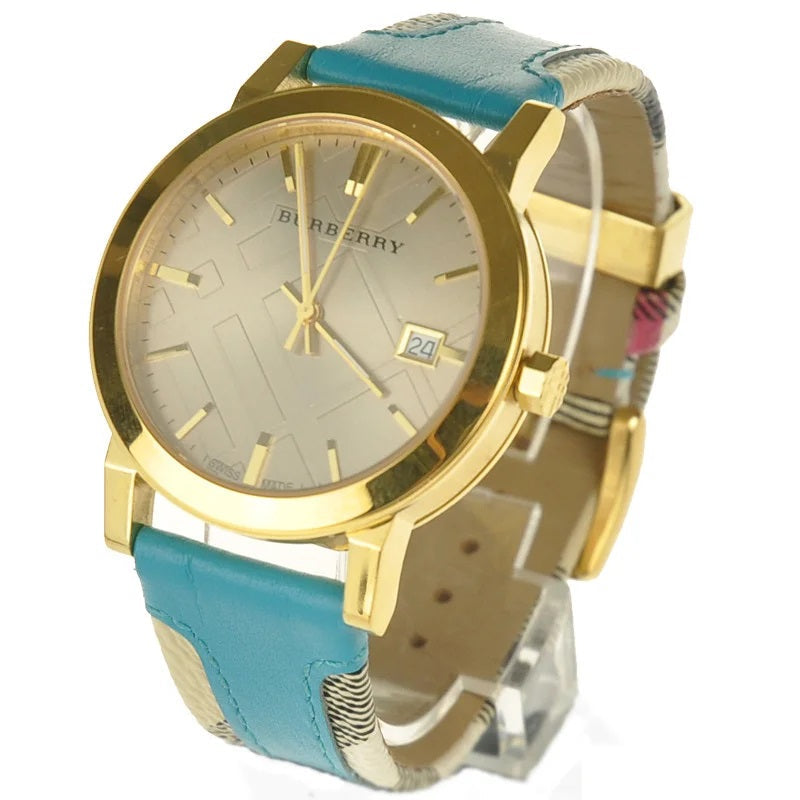 Burberry BU9018 watch at 45-degree angle showing turquoise and striped leather strap