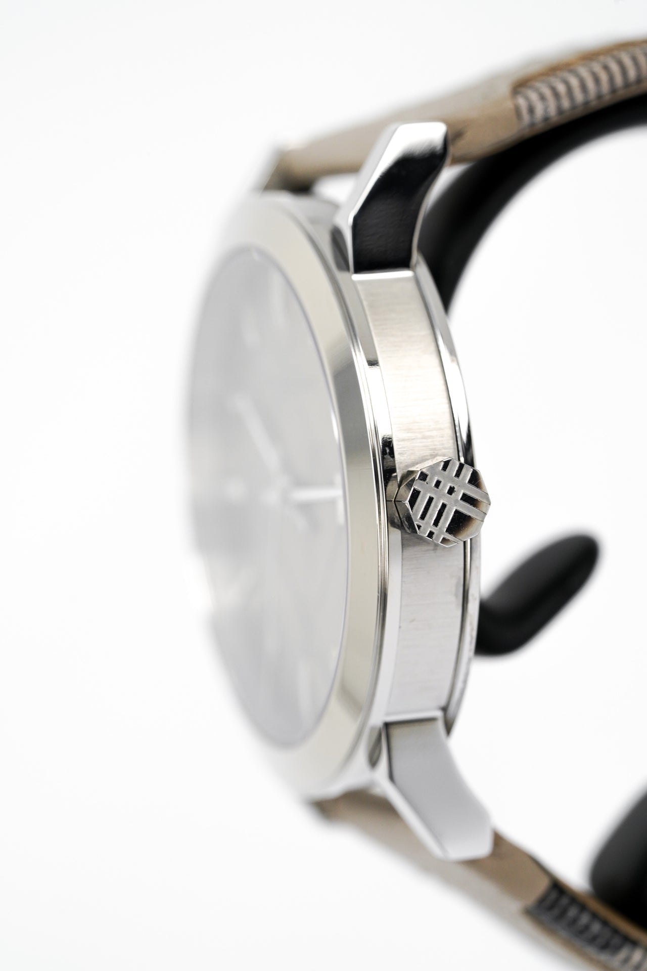 Burberry BU9021 watch side profile showing silver case profile and beige leather strap