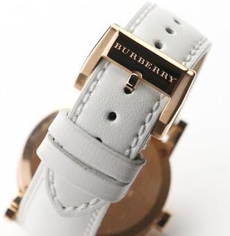 White leather strap with Burberry brand tab and rose gold buckle on Burberry watch