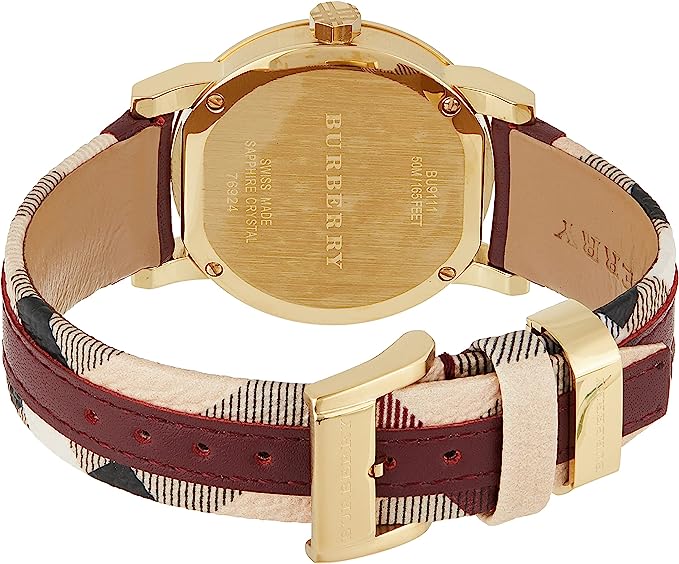 Caseback view of Burberry BU9111 watch displaying engraved text and gold-tone case