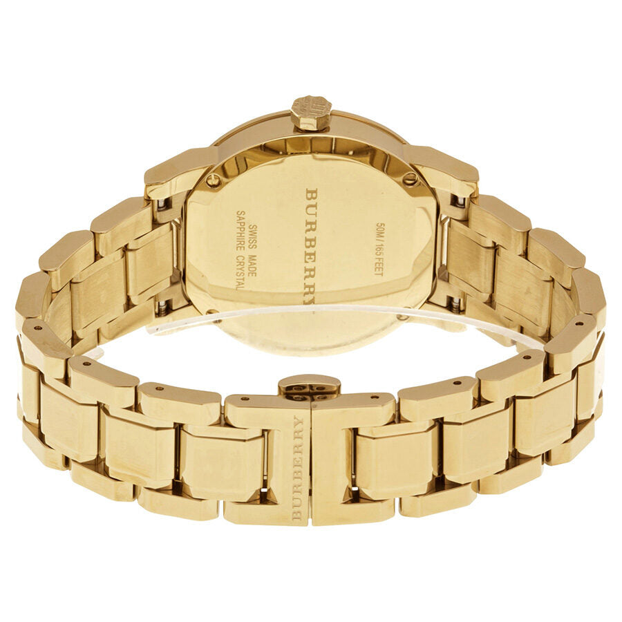 Burberry BU9134 watch caseback showing engraved gold-tone stainless steel back and link bracelet