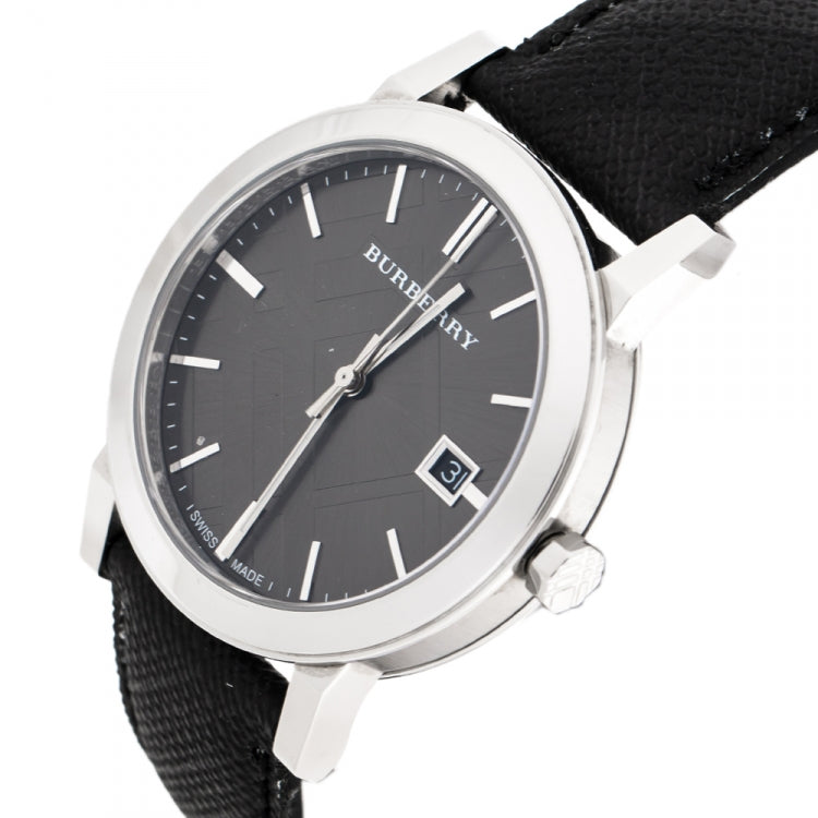 Burberry City watch angled view showing black dial, silver case, and date window