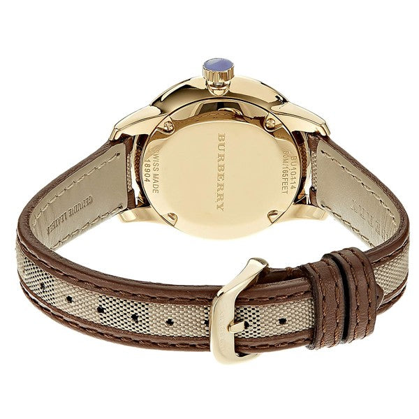 Caseback view of Burberry Classic watch displaying Burberry branding and engraved text on gold case