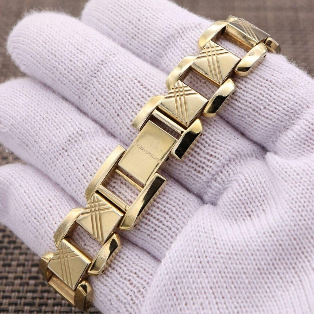 Burberry Heritage BU4213 gold-tone quilted link bracelet detail held on white fabric