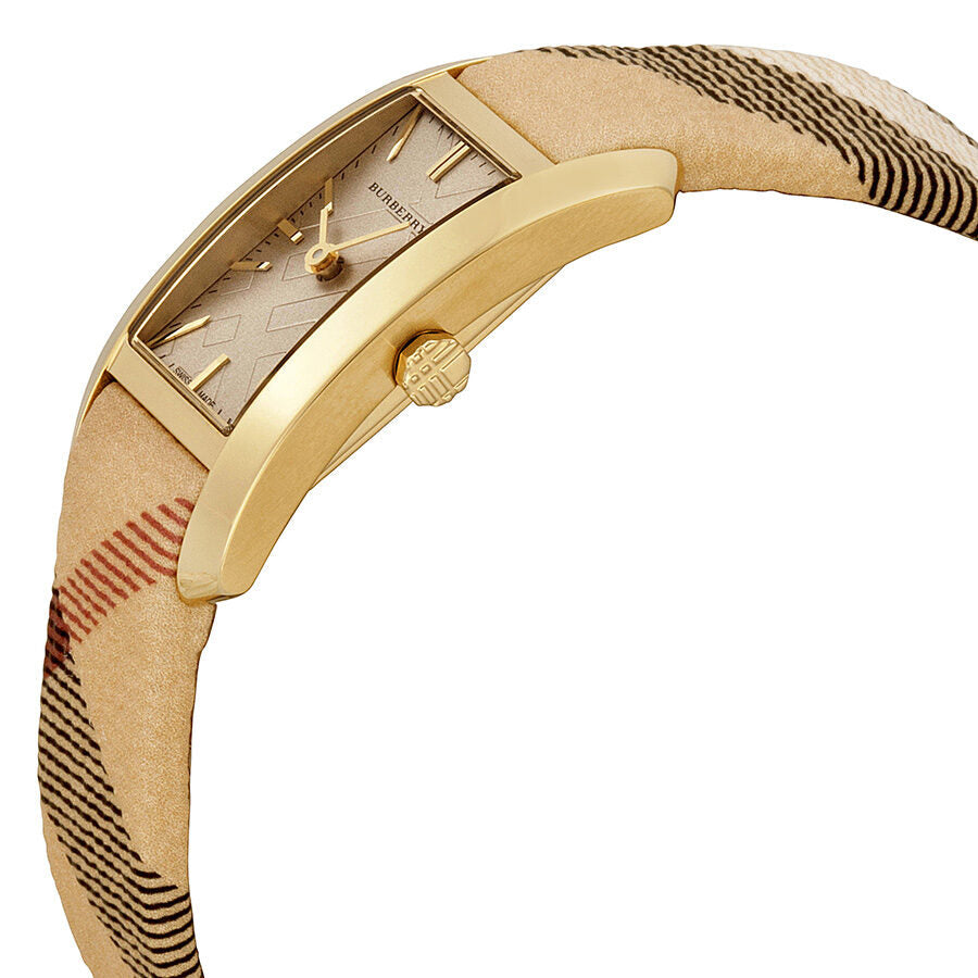 Side angle view of Burberry Pioneer watch showing curved gold case and textured check strap