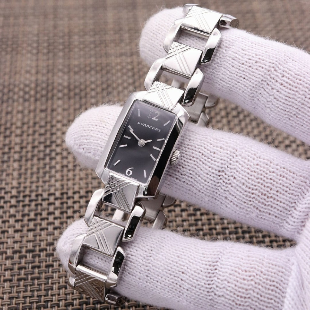 Burberry Signature BU4210 women's watch on wrist showing black dial and quilted steel links