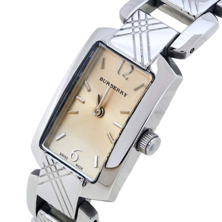 Angled view of Burberry Signature watch showing dial and checked steel strap