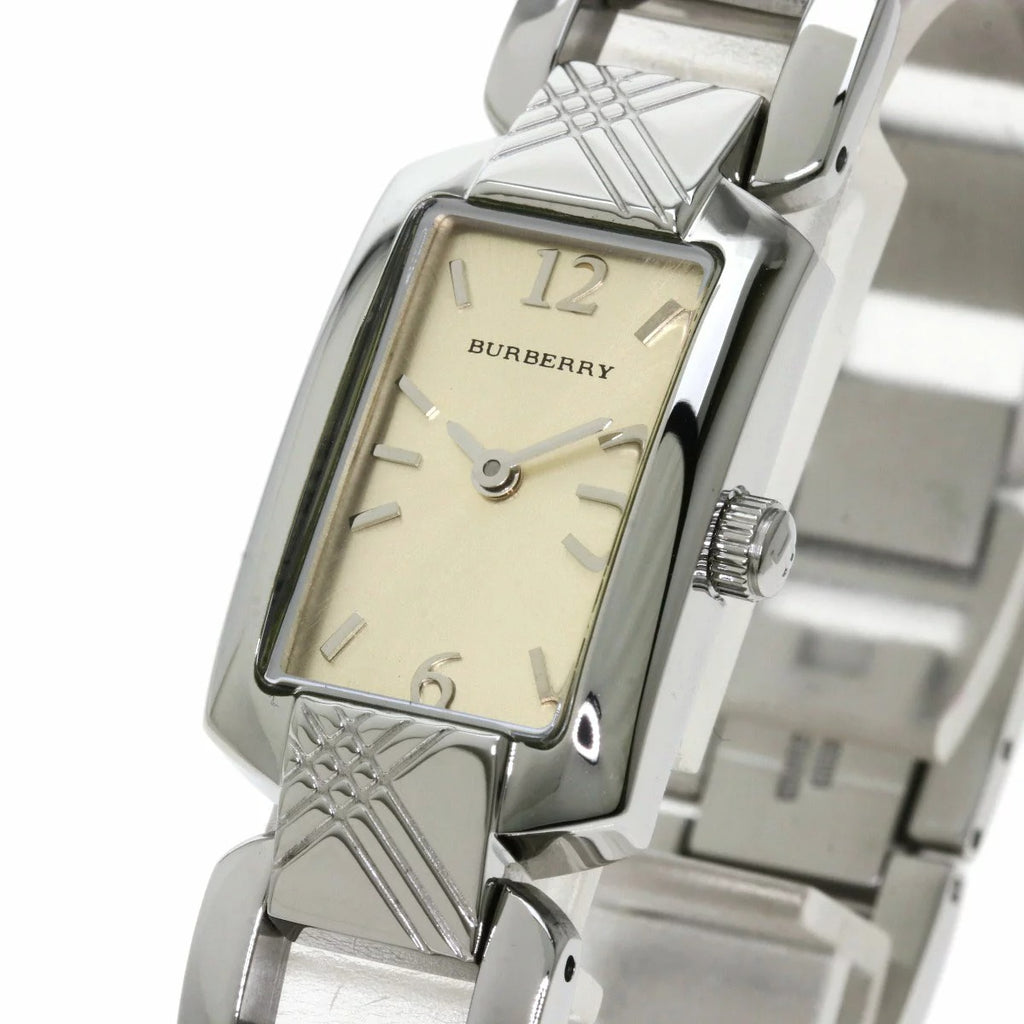 Close-up of rectangular silver dial with Burberry branding and hour markers