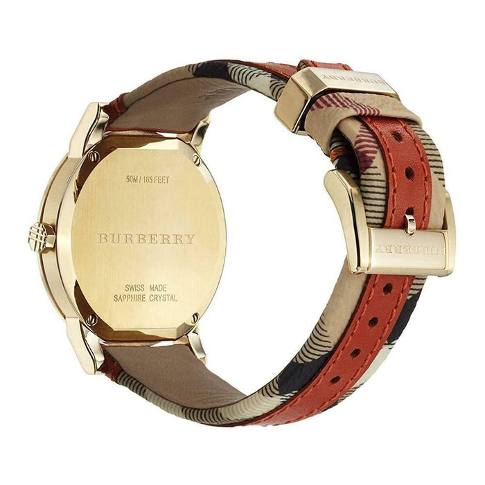 Burberry The City watch showing gold-tone caseback engraved with brand name and sapphire crystal specification