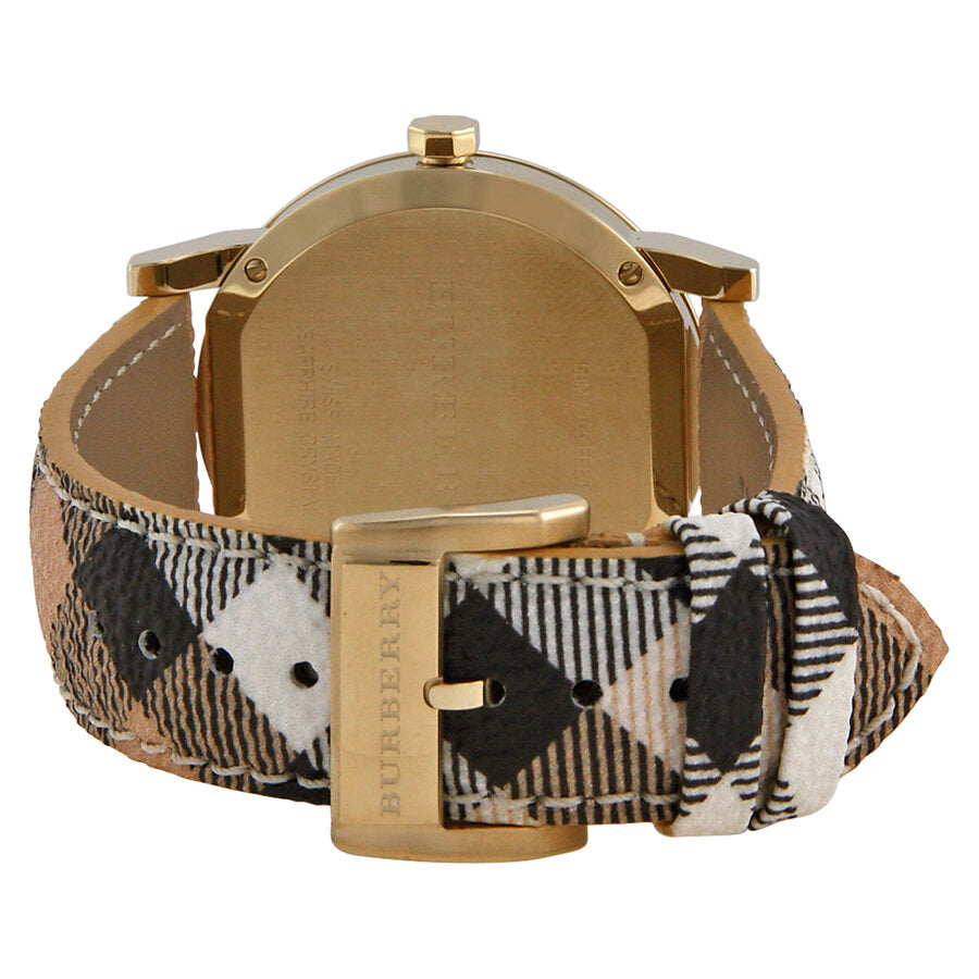 Caseback view of Burberry The City watch with Haymarket check fabric strap and gold buckle